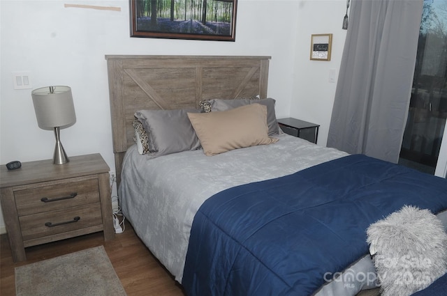 bedroom with wood finished floors