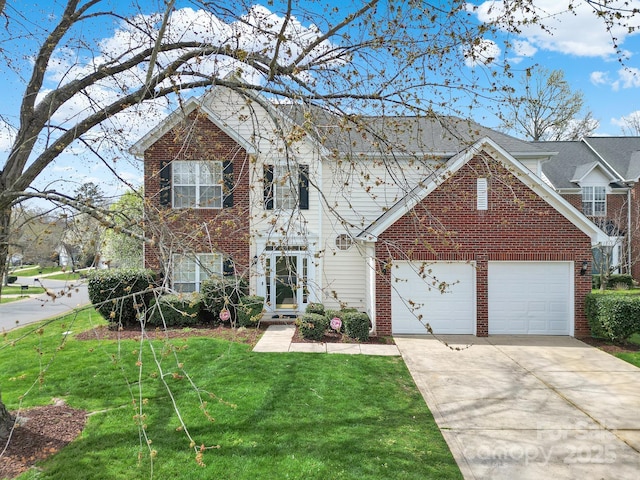 view of front facade with brick siding, a garage, driveway, and a front yard