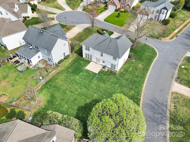 birds eye view of property with a residential view