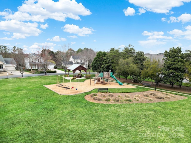 communal playground featuring a gazebo and a lawn