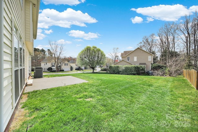 view of yard featuring central air condition unit, a patio, and fence