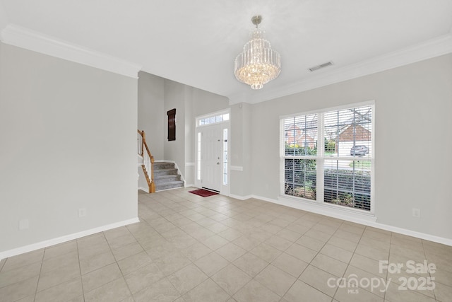 entryway featuring baseboards, a chandelier, stairs, and crown molding