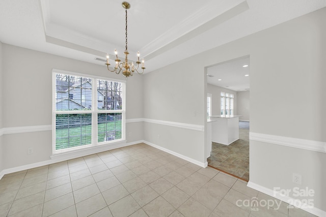 spare room featuring light tile patterned floors, a tray ceiling, baseboards, and an inviting chandelier