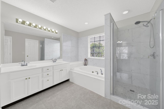 full bath featuring a sink and a marble finish shower