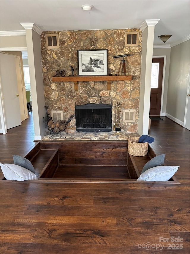 living room featuring crown molding and visible vents