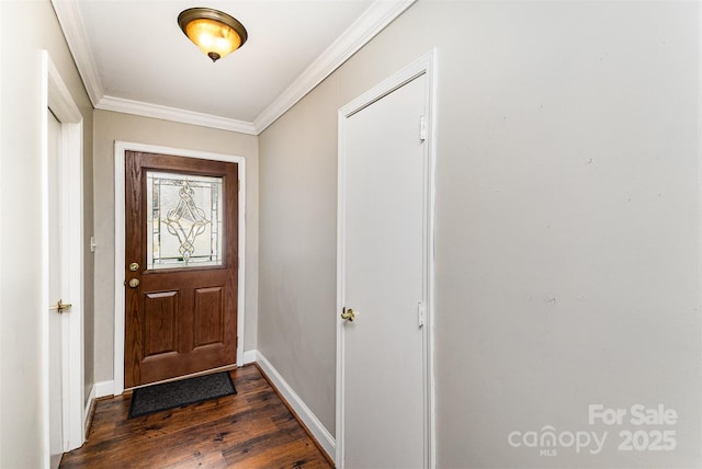 entryway featuring dark wood-style floors, baseboards, and ornamental molding