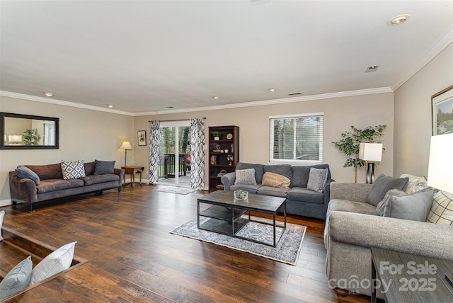 living room with dark wood-style floors, baseboards, visible vents, recessed lighting, and ornamental molding