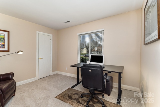 home office with visible vents, carpet floors, and baseboards