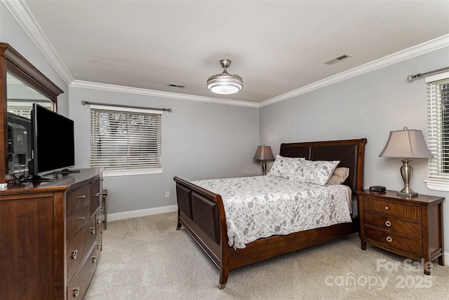 bedroom featuring crown molding, light colored carpet, visible vents, and baseboards