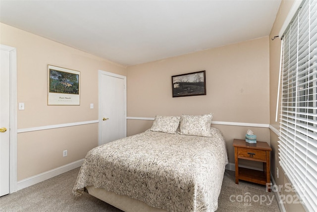 carpeted bedroom with baseboards