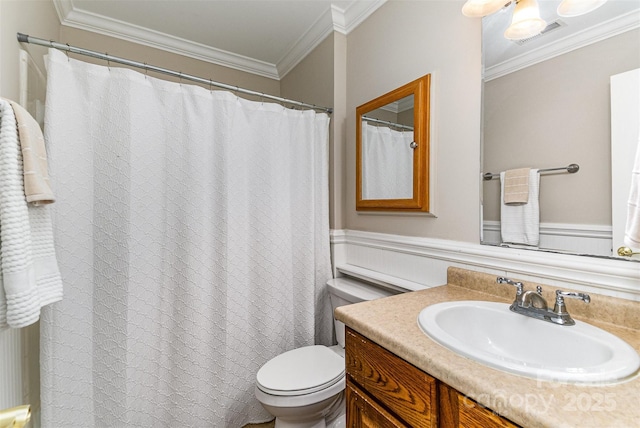 bathroom featuring vanity, toilet, visible vents, and ornamental molding