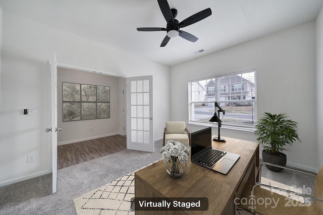 carpeted office with visible vents, lofted ceiling, french doors, baseboards, and ceiling fan