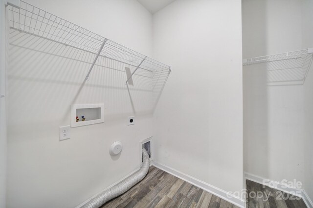 washroom with hookup for a washing machine, wood finished floors, hookup for an electric dryer, laundry area, and hookup for a gas dryer