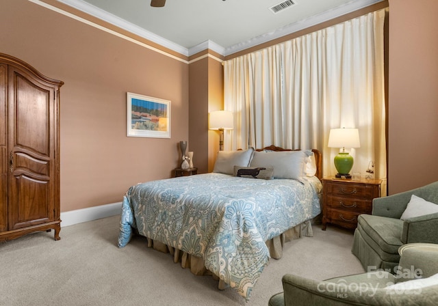 carpeted bedroom featuring ceiling fan, baseboards, visible vents, and ornamental molding