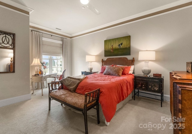 bedroom featuring visible vents, baseboards, ornamental molding, and carpet flooring