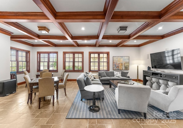 living area featuring beamed ceiling, coffered ceiling, and baseboards