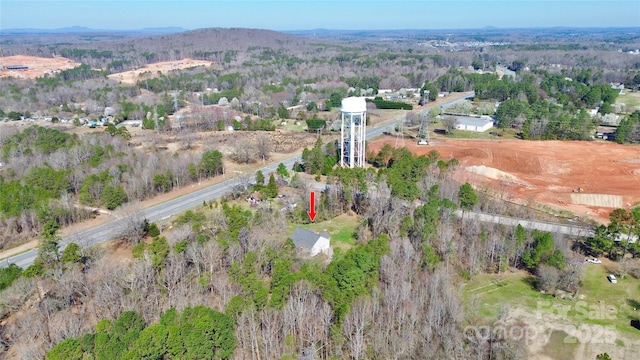 birds eye view of property with a mountain view