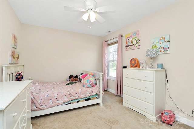 bedroom with light colored carpet, visible vents, and ceiling fan