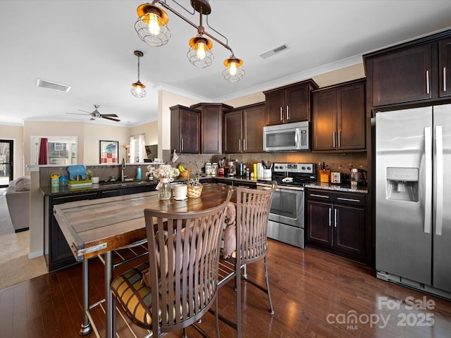 430 Battery Cir, Clover, SC 29710 - kitchen with a sink, stainless steel appliances, visible vents, and dark brown cabinets