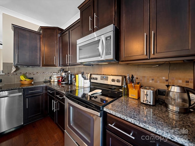 430 Battery Cir, Clover, SC 29710 - kitchen with decorative backsplash, stainless steel appliances, dark stone counters, and dark wood-style flooring