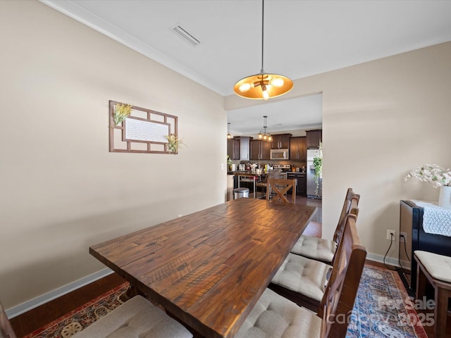 430 Battery Cir, Clover, SC 29710 - dining area featuring visible vents, baseboards, a notable chandelier, and wood finished floors