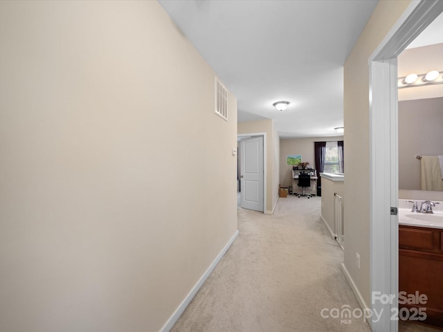 430 Battery Cir, Clover, SC 29710 - corridor with visible vents, light colored carpet, baseboards, and a sink