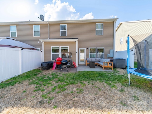 430 Battery Cir, Clover, SC 29710 - rear view of property featuring a patio, a trampoline, a fenced backyard, outdoor lounge area, and central AC unit
