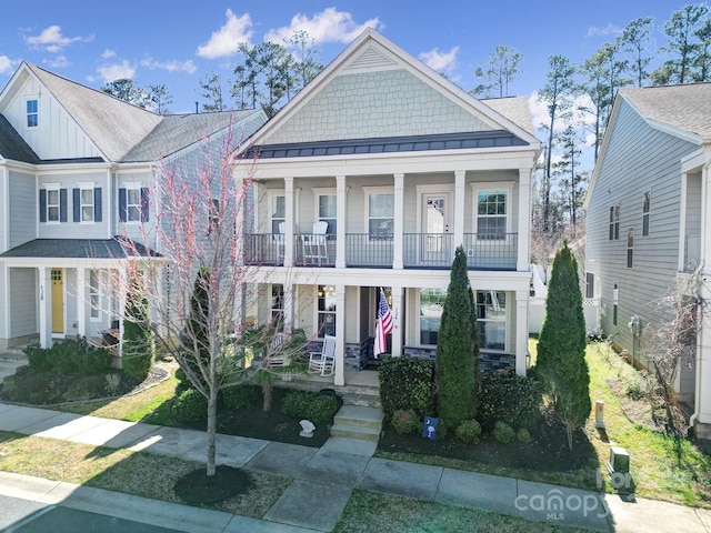 view of front of property with covered porch and a standing seam roof