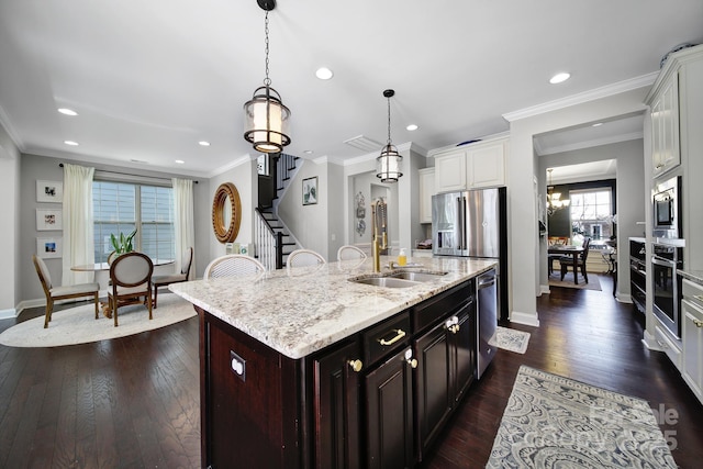 kitchen featuring a sink, crown molding, dark wood-style floors, and stainless steel appliances