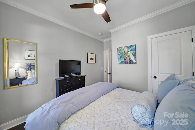 bedroom with ceiling fan, baseboards, and ornamental molding