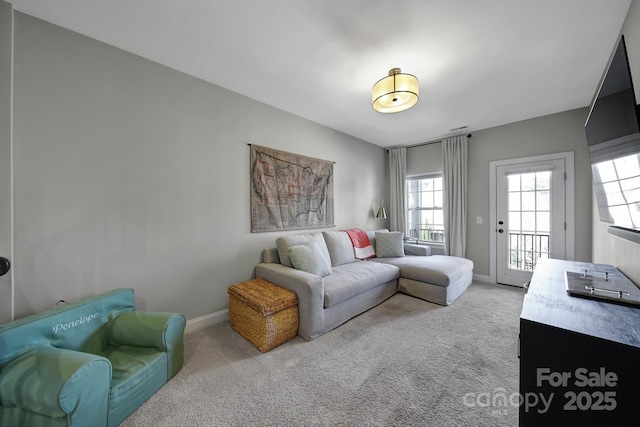 living room with carpet flooring and baseboards