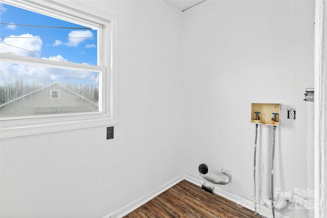 laundry area with dark wood finished floors, laundry area, hookup for a washing machine, and baseboards