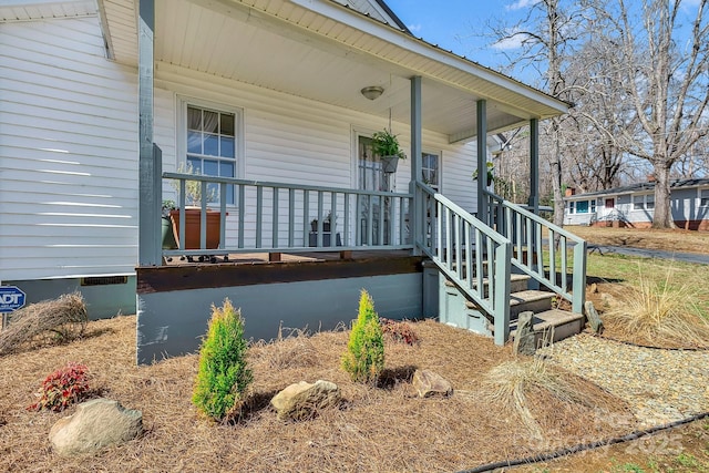 property entrance with covered porch