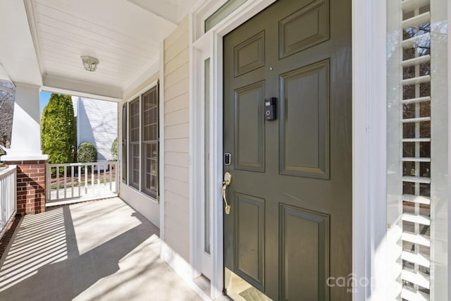 property entrance featuring covered porch