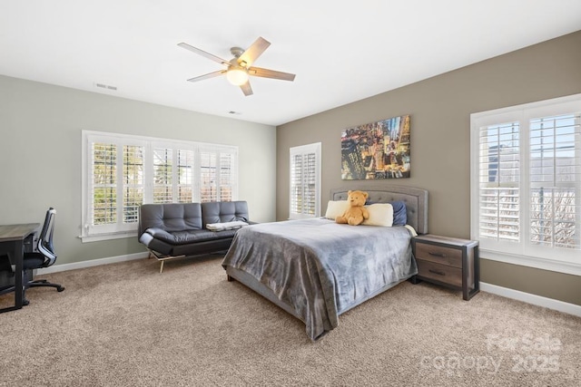 bedroom with light carpet, visible vents, a ceiling fan, and baseboards