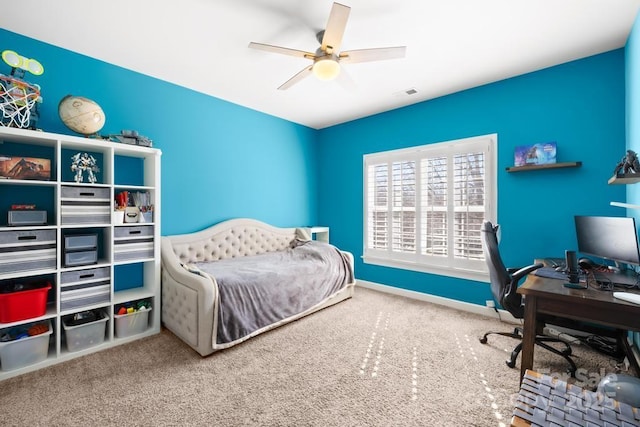 carpeted bedroom with a ceiling fan, baseboards, and visible vents