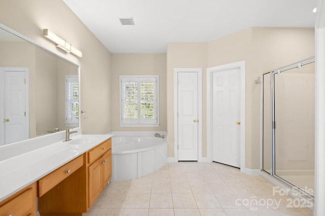 bathroom with vanity, visible vents, a stall shower, tile patterned flooring, and a garden tub