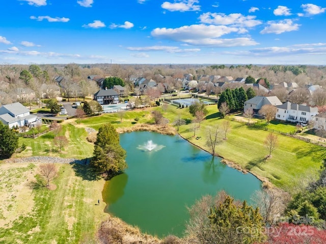 birds eye view of property with a residential view and a water view