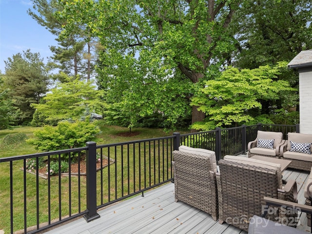 wooden terrace featuring a yard