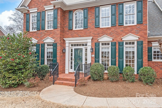 view of front of house with brick siding