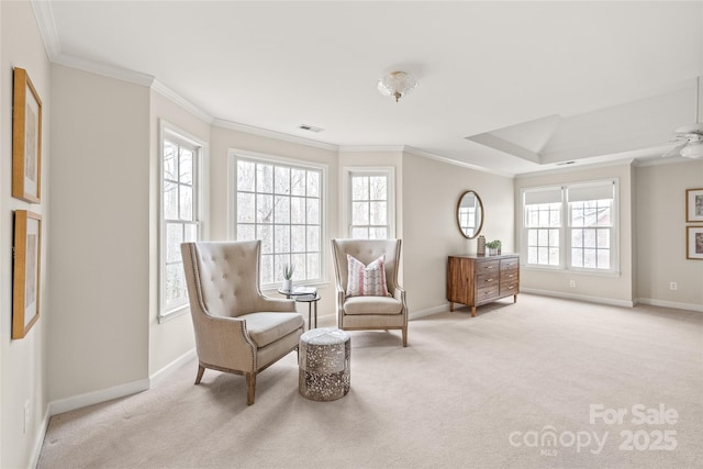 sitting room featuring visible vents, light carpet, and ornamental molding