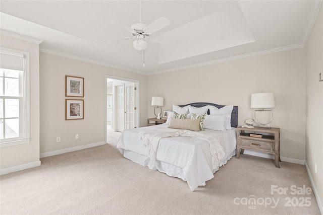 bedroom featuring baseboards, light carpet, and crown molding