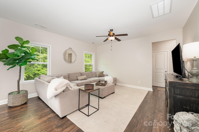 9428 Segundo Ln, Charlotte, NC 28278 - living area featuring dark wood finished floors, visible vents, a ceiling fan, and baseboards