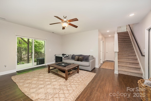 9428 Segundo Ln, Charlotte, NC 28278 - living room featuring stairway, a ceiling fan, baseboards, and dark wood-style flooring