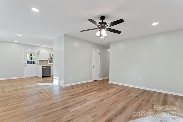 interior space with recessed lighting, a ceiling fan, light wood-type flooring, and baseboards