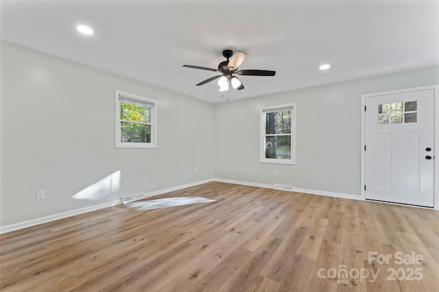 interior space featuring visible vents, baseboards, and light wood-style floors