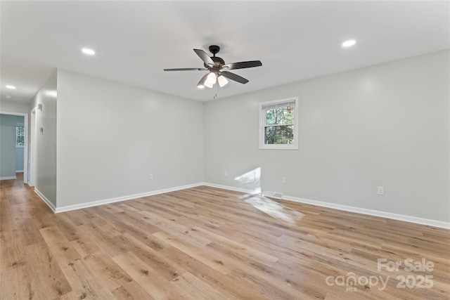 spare room featuring recessed lighting, baseboards, ceiling fan, and light wood finished floors