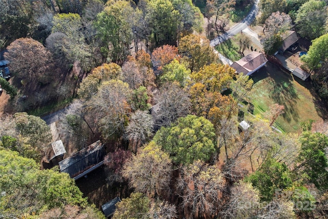 aerial view featuring a view of trees