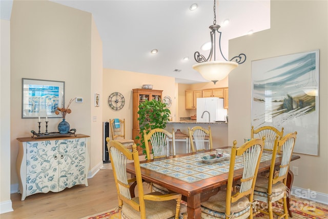 dining space with recessed lighting, visible vents, baseboards, and light wood finished floors