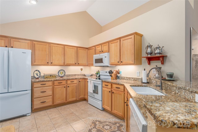 kitchen with high vaulted ceiling, a sink, white appliances, light tile patterned floors, and light stone countertops